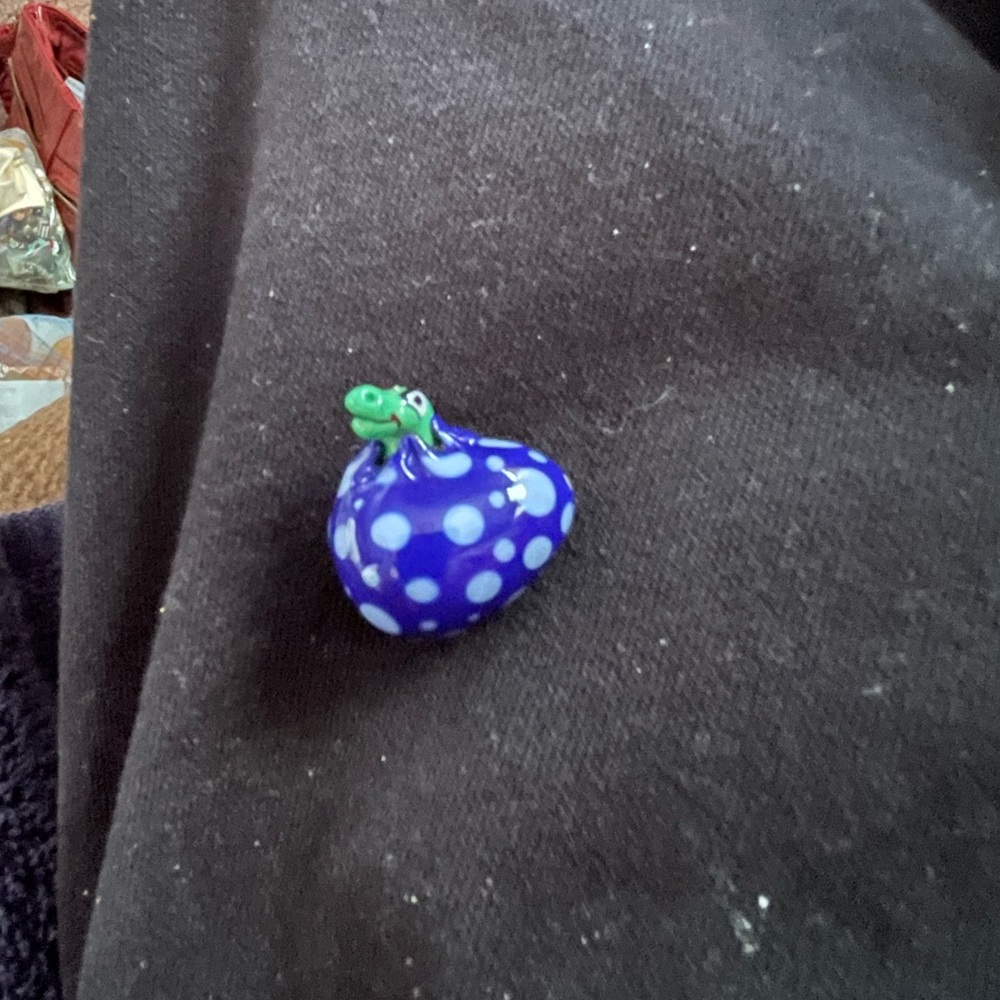 This is a Dinosaur glass bead. Reduced